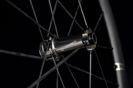 Close-up of a rear hub and freehub body with the spokes running away from it